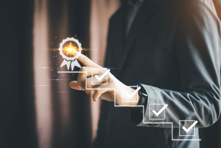 business man checking off goals and achievements checklist